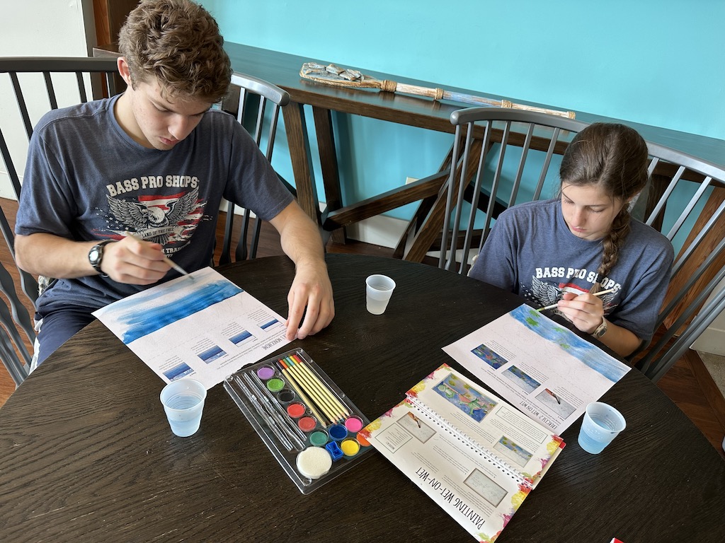 Two Kids Painting Ships