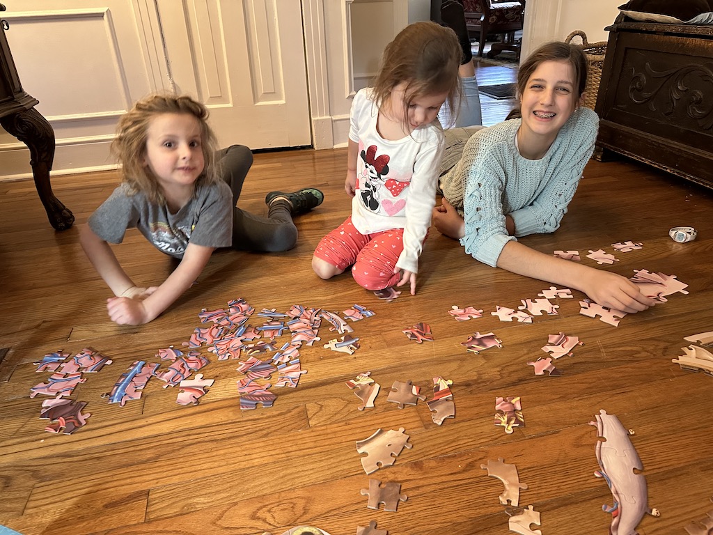 Girls working puzzle